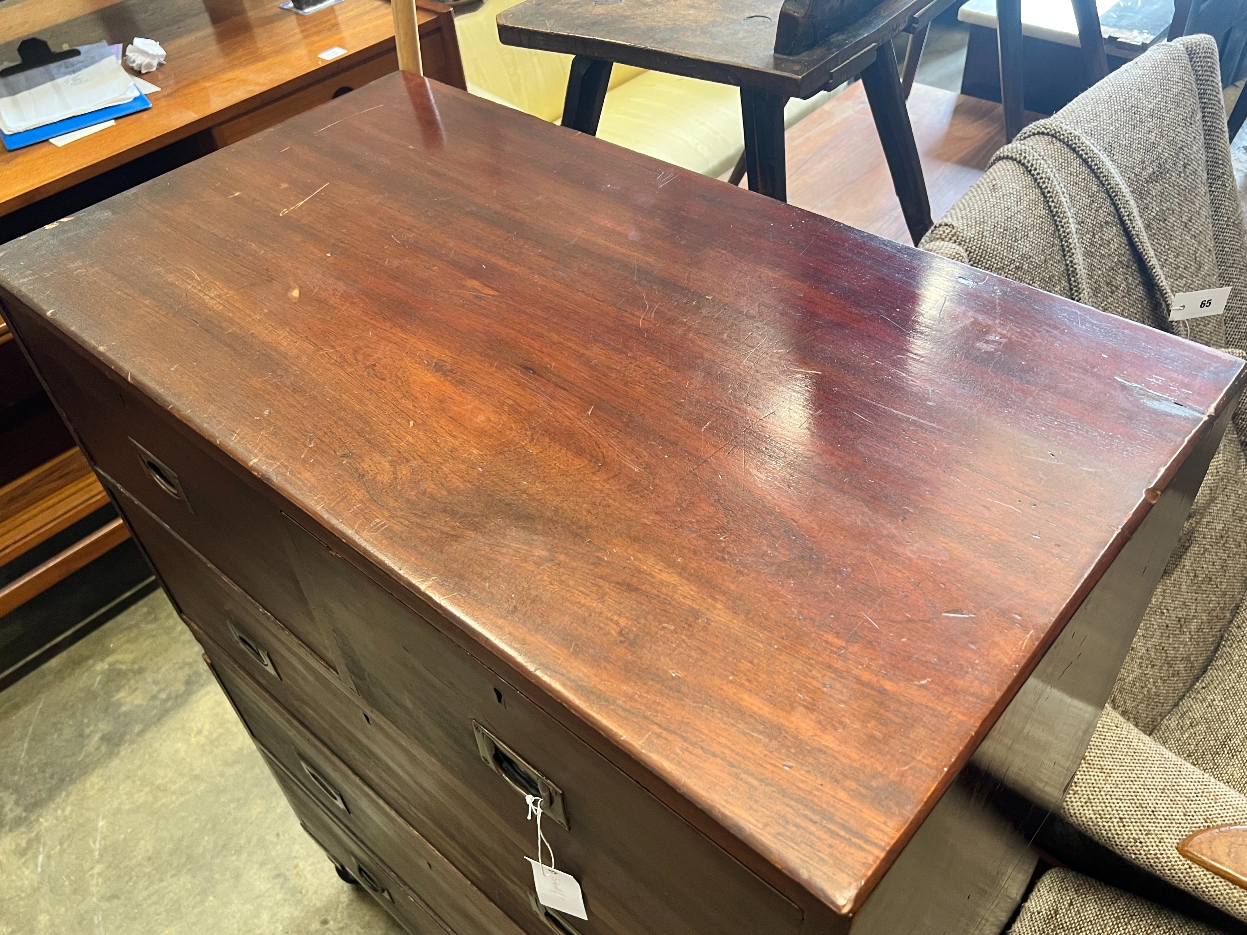 A 19th century teak two part military chest, bears paper label H.T. Jones & Sons, Parramatta, width 86cm depth 46cm height 113cm